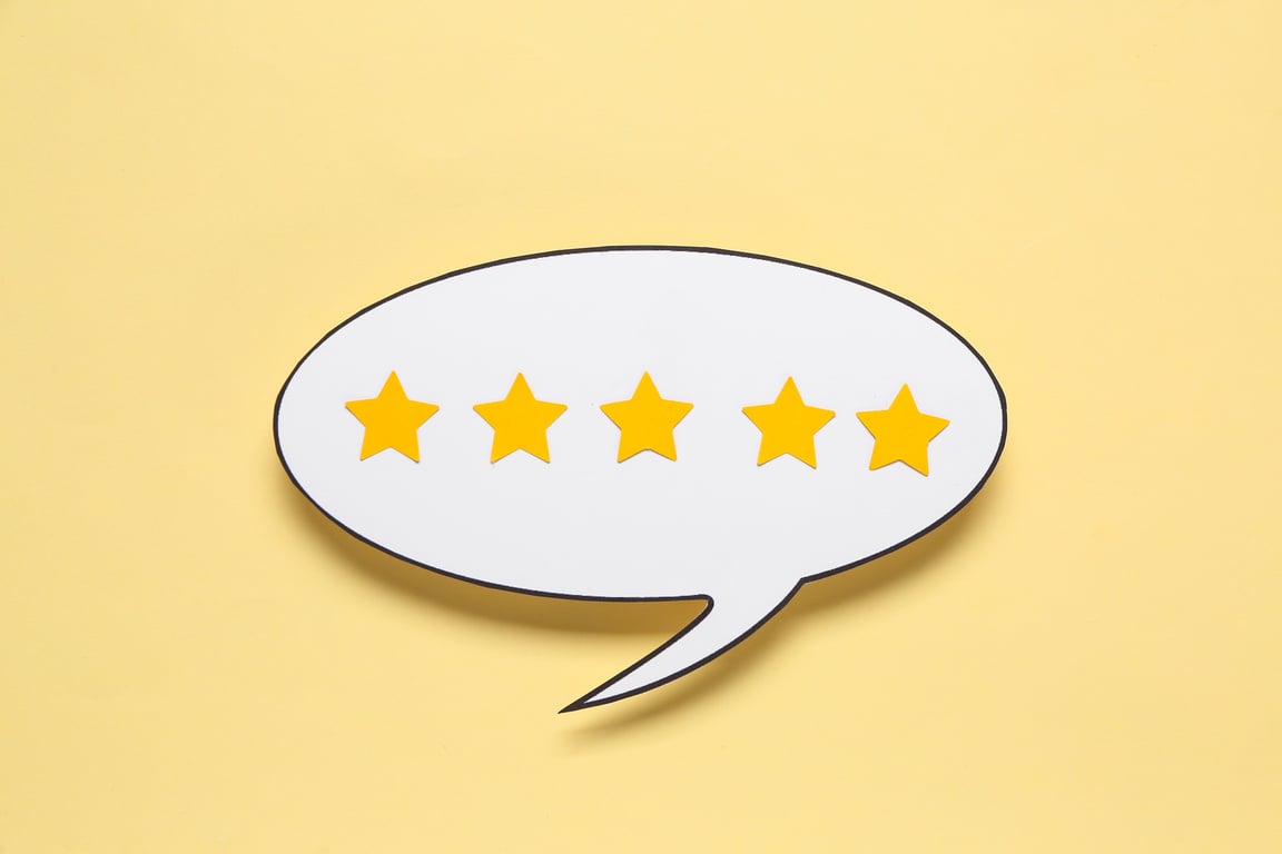 Speech Bubble with Five Stars Rating on Yellow Background. Customer Experience Concept